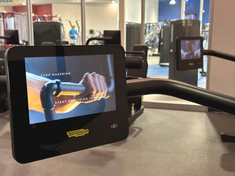Gym equipment screen displaying motivational message.