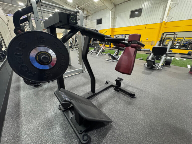 Leg press machine in a gym setup