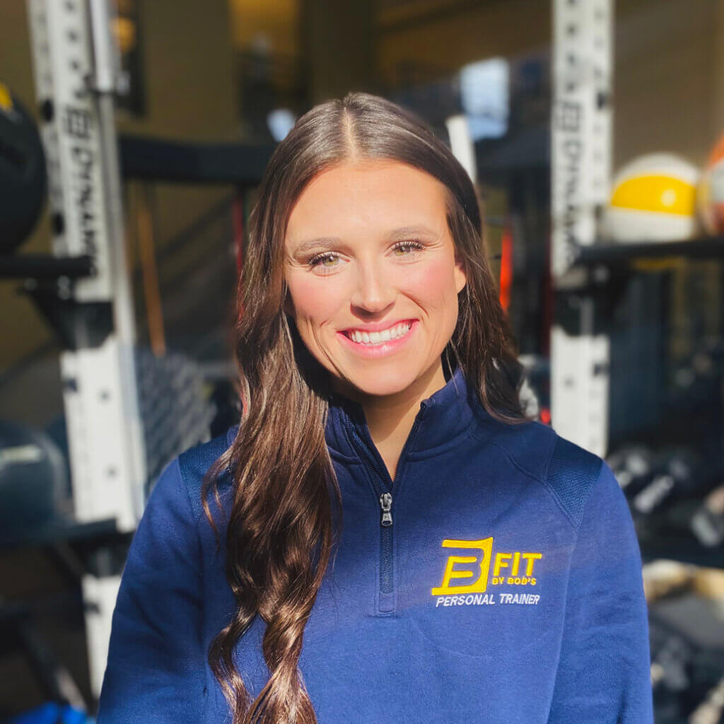 Smiling personal trainer at the gym.